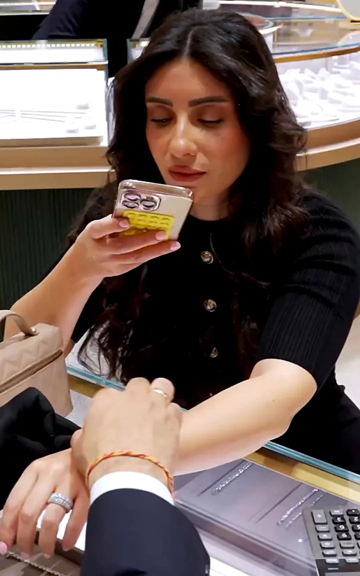 An Evermore jewellery expert guiding a client through pieces at the counter